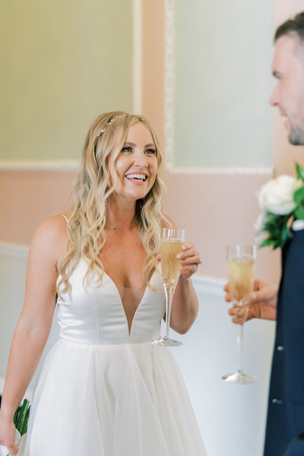 Bride and groom drink champagne