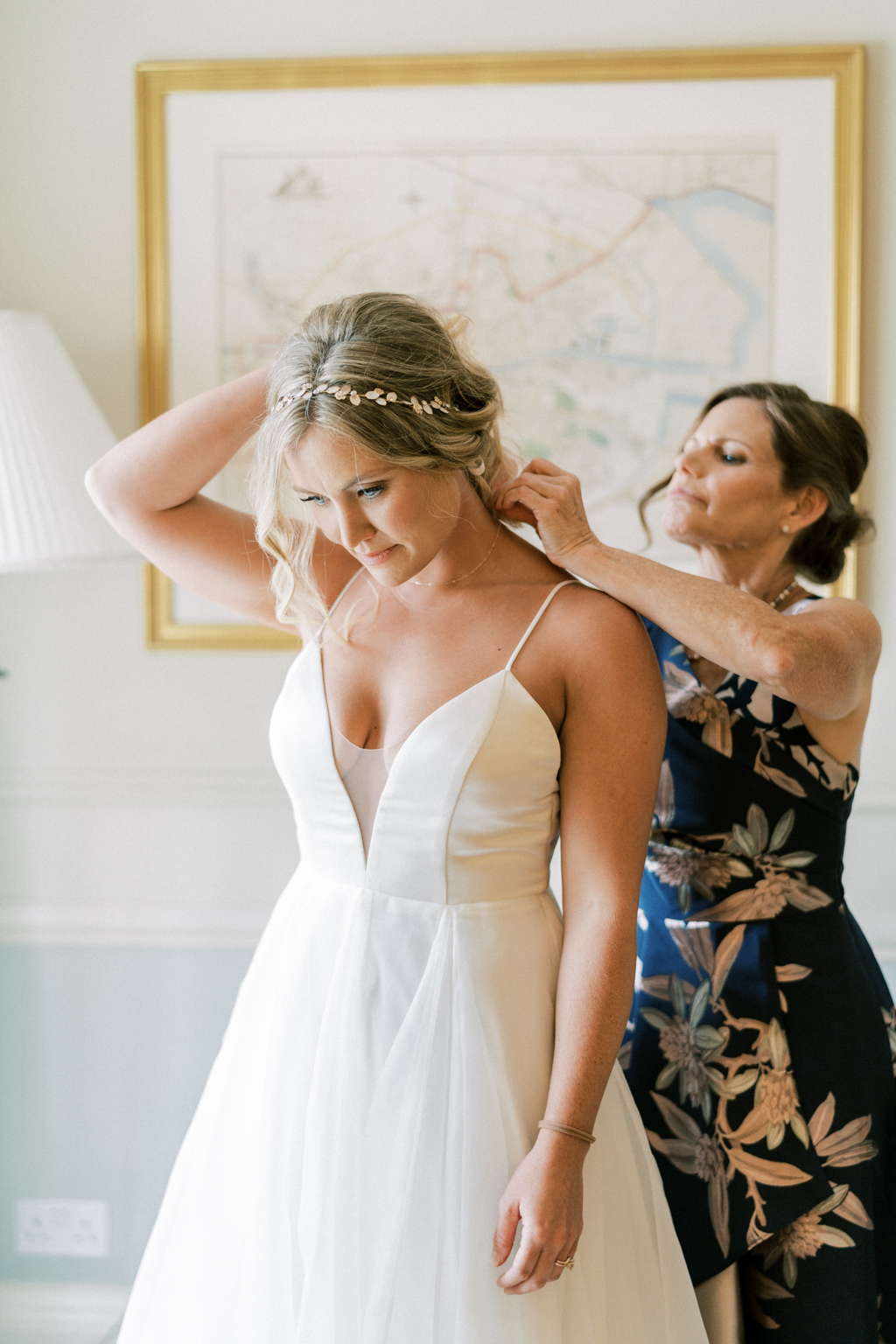 Mother getting bride ready blonde hair