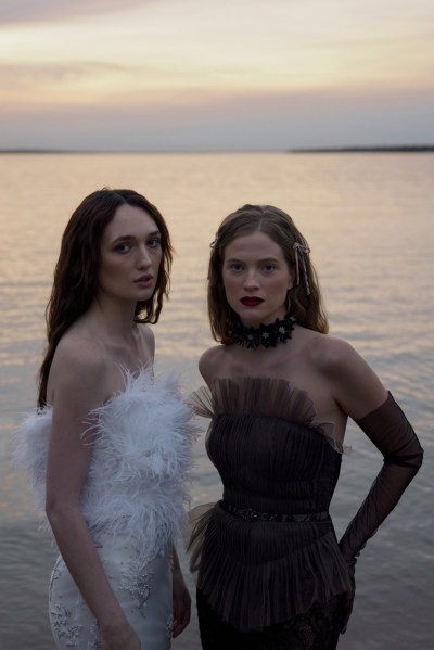 Hermione de Paula's new 2023 collection: 'Moon Phases' tight-fitting feather dress and black swan gown wedding in front of lake setting