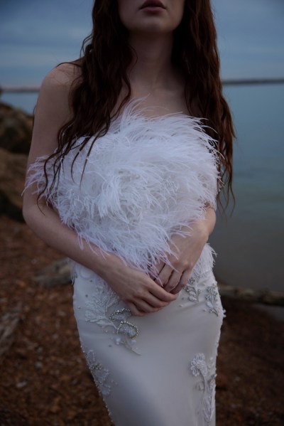 Hermione de Paula's new 2023 collection: 'Moon Phases' feather white patterned dress evening shot in front of lake