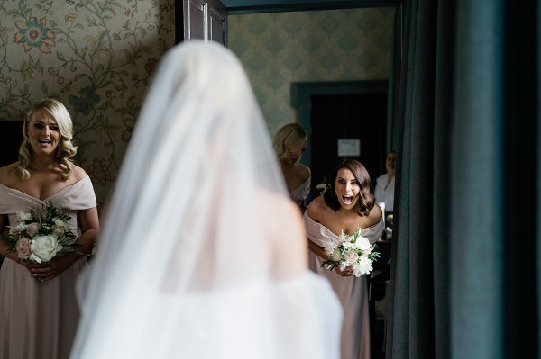 Bridesmaids see bride for the first time they react