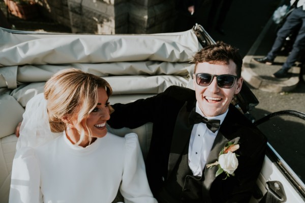 Bride and groom in wedding car