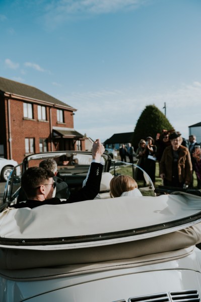 Bride and groom in wedding car