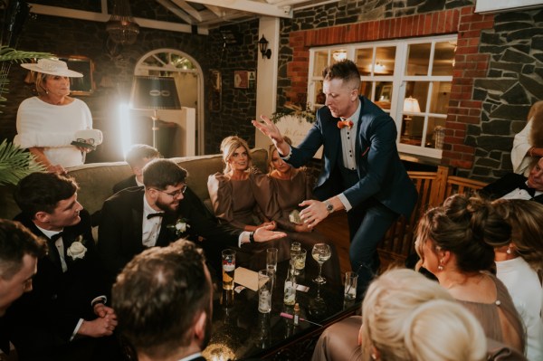 Group of men and women seated pub setting