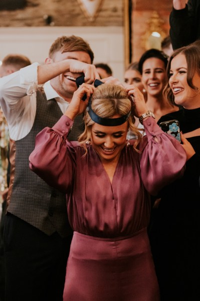 Woman wearing pink dress and headband