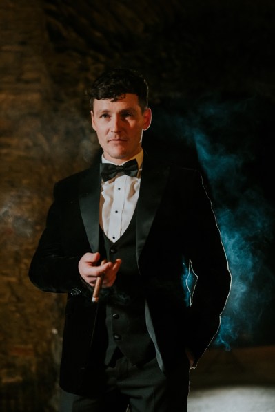 Groom wearing bowtie black suit