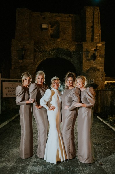 Dark shot of bride and bridesmaids