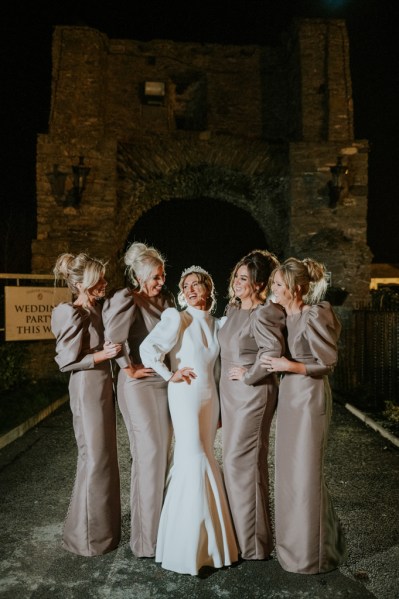 Dark shot of bride and bridesmaids