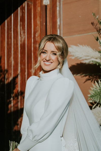 Close up of bride smiling blonde waves