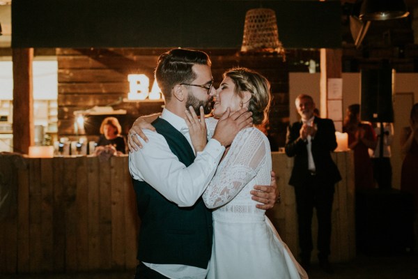 Bride and groom kiss on the dancefloor