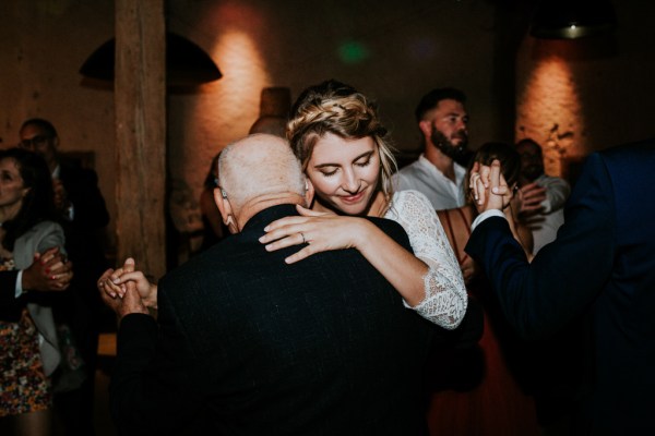 Bride hugs father emotional embrace