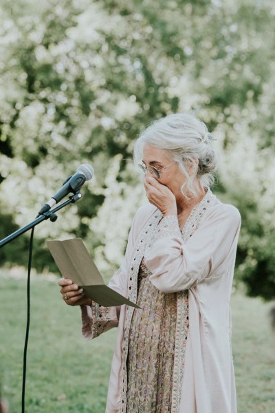 Emotional woman gives speech during ceremony