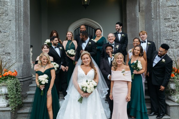 Family portrait bride groom bridesmaids friends groomsmen on steps