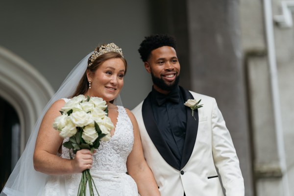 Bride and groom pose for a photo