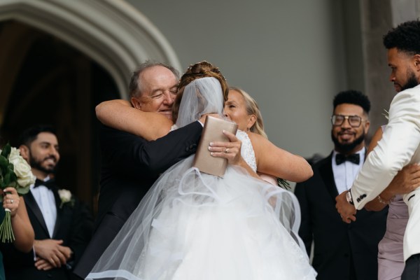 Bride hugs her father