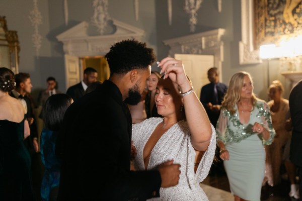 Shot of bride and groom dancing on the dancefloor