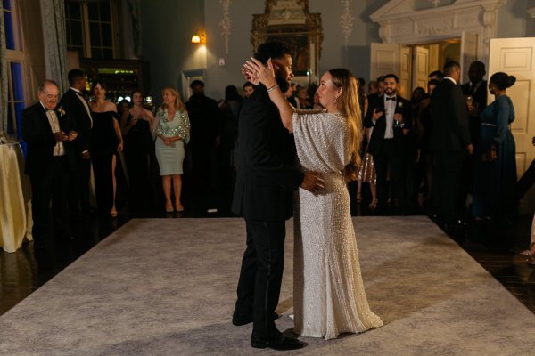 Shot of bride and groom dancing on the dancefloor