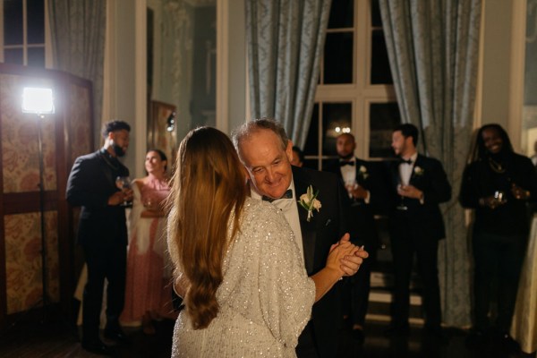 Bride and father hug/embrace