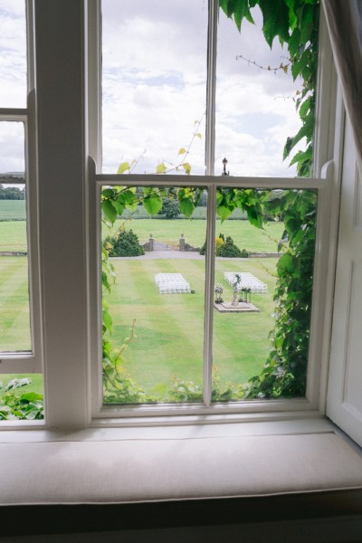 Garden view of ceremony from bedroom window