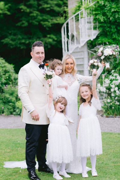 Family portrait bride groom and daughters two little girls