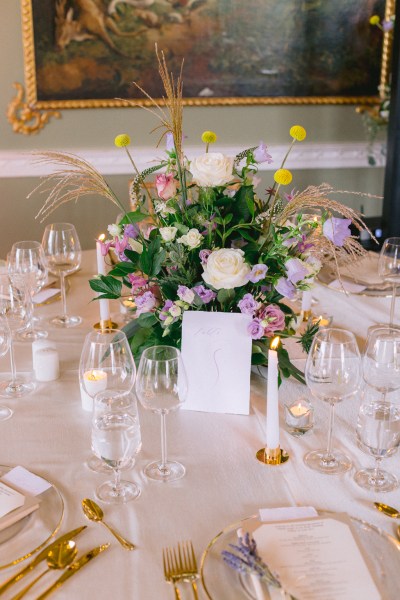 Table candles lit flowers roses on table