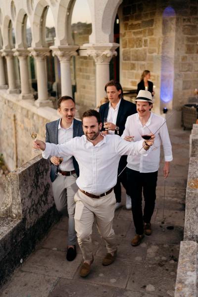 Men walking up the steps to wedding venue