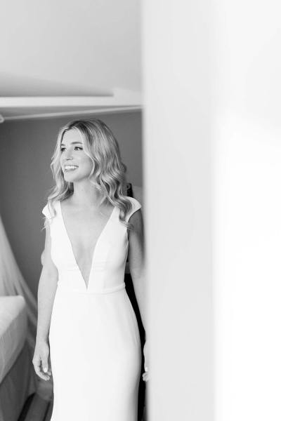 Black and white image of bride getting ready