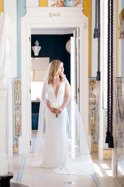 Bride stands on her own looks to her left