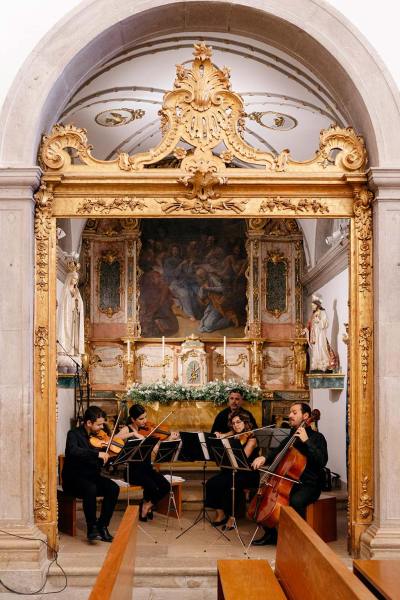 Wedding band in church playing cello violin music