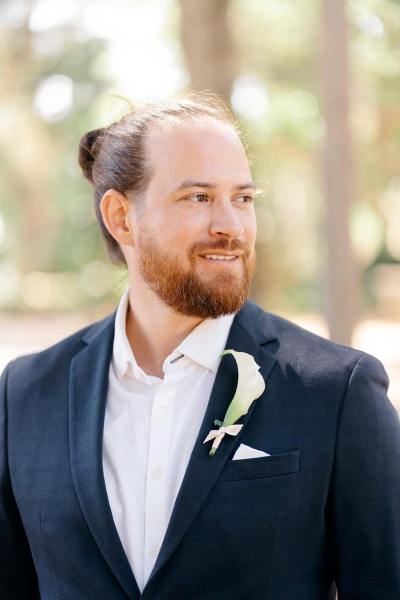 Groom on his own poses