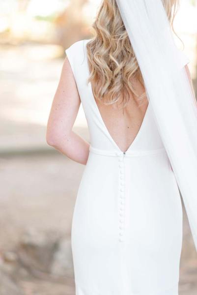 Back of brides dress veil and hair detail