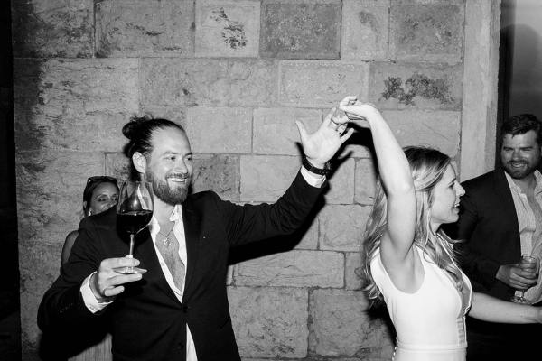 Black and white of bride and groom dancing