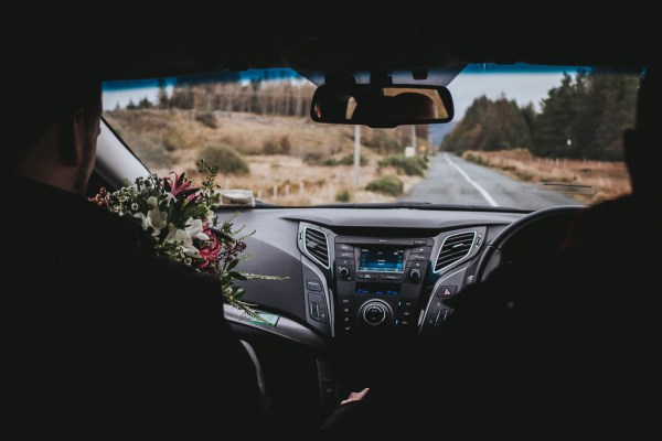 Car view of bride and groom view of road