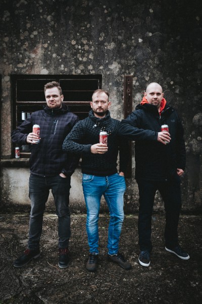 Groom and groomsmen drink red ale