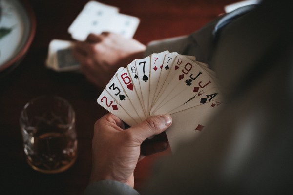 Groom and his groomsmen play cards