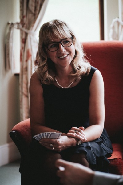 Woman smiles in red chair