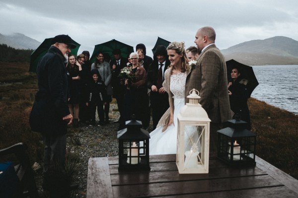 Black and white lantern shots bride groom and guests behind them