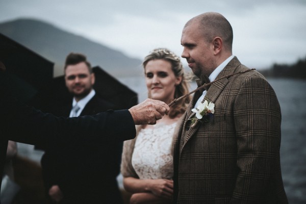 Bride groom and celebrant during ceremony