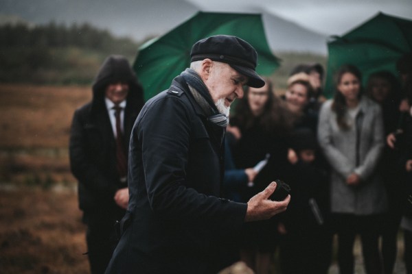 Celebrant gives sermon to guests and couple