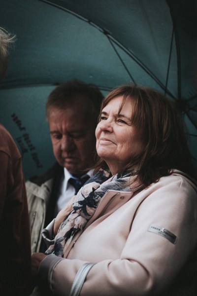 Emotional woman under umbrella