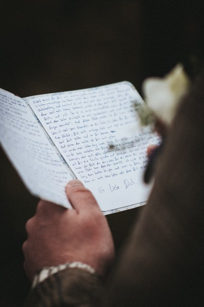 Groom reading vows in t bookle