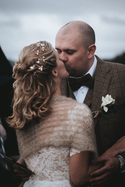 Bride and groom kiss kissing