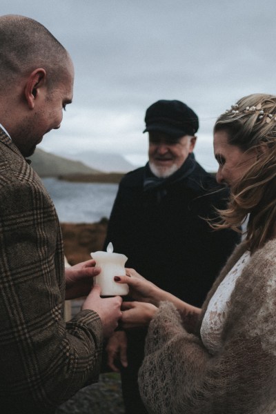 Bride and groom with sea in background and mountains