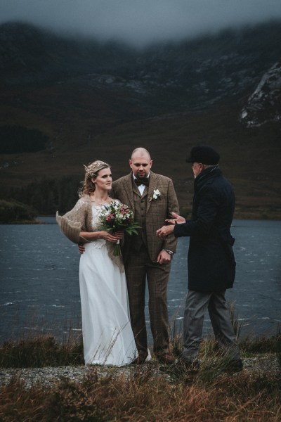 Celebrant bride and groom sea in background