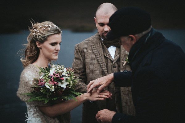 Celebrant bride and groom she puts out her hands