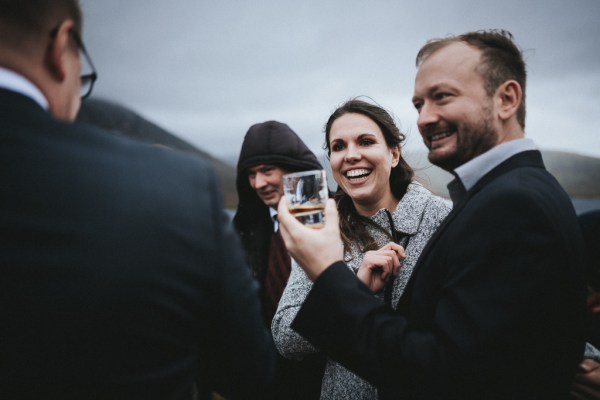 Guests laughing smiling at couple