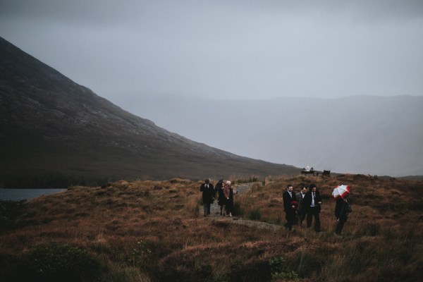 Guests walk back through mountains walkway