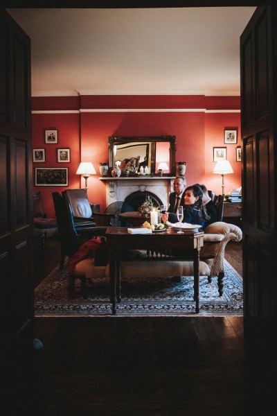 Interior manor house setting couch portraits homely