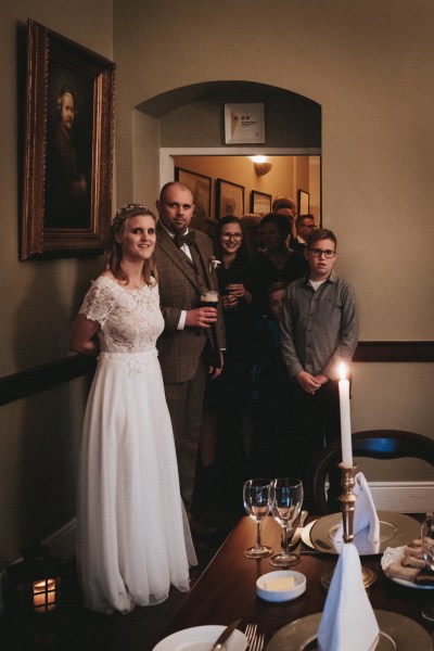 Bride groom and guests inside ballroom