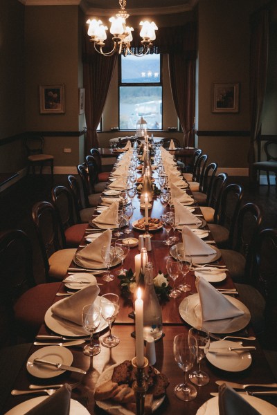 Table decor setting candles lit and cutlery